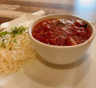 Butter chicken with rice from Indian food restaurant near me in San Diego